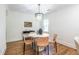 Bright dining room featuring hardwood floors, modern chandelier, and seating for four at 139 Sisson Ne Ave, Atlanta, GA 30317