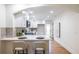 Bright kitchen with white cabinets, stainless appliances and a view to the dining room at 139 Sisson Ne Ave, Atlanta, GA 30317