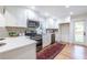 Bright kitchen featuring stainless appliances, white cabinetry and a convenient breakfast bar at 139 Sisson Ne Ave, Atlanta, GA 30317