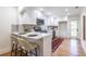 Beautiful kitchen with white cabinets, stainless appliances, and breakfast bar seating at 139 Sisson Ne Ave, Atlanta, GA 30317