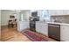 Modern kitchen with stainless steel appliances, quartz counters and breakfast bar at 139 Sisson Ne Ave, Atlanta, GA 30317