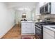 Modern kitchen with stainless steel appliances, quartz counters and a view to the dining room at 139 Sisson Ne Ave, Atlanta, GA 30317