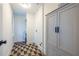 Well-lit laundry room features stylish geometric floors and a built-in storage cabinet at 139 Sisson Ne Ave, Atlanta, GA 30317