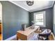 Cozy home office with ample natural light, wood floors and a stylish writing desk at 139 Sisson Ne Ave, Atlanta, GA 30317