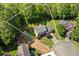 Aerial view showcasing the property lines, landscape design, and location surrounded by mature trees at 1661 Duxbury Nw Ln, Kennesaw, GA 30152