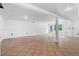 Large, unfinished basement with white walls and tile floors at 1661 Duxbury Nw Ln, Kennesaw, GA 30152