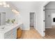 Bright bathroom with double vanity, recessed lights, and wood-look flooring at 1661 Duxbury Nw Ln, Kennesaw, GA 30152