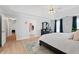 Bright bedroom with a ceiling fan, ensuite, closet, and wood-look flooring at 1661 Duxbury Nw Ln, Kennesaw, GA 30152