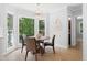 Bright breakfast nook features a chandelier, natural light, and an adjacent decorative wall art at 1661 Duxbury Nw Ln, Kennesaw, GA 30152