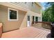 A spacious wooden deck with a grill offers an inviting outdoor entertaining space with backyard views at 1661 Duxbury Nw Ln, Kennesaw, GA 30152