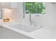 Kitchen sink beneath a window, offering light and a view when doing dishes at 1661 Duxbury Nw Ln, Kennesaw, GA 30152