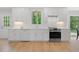 Modern kitchen with white cabinets, quartz countertops, stainless steel appliances, and a garden view at 1661 Duxbury Nw Ln, Kennesaw, GA 30152