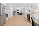 Spacious kitchen with stainless steel appliances, stone countertops, and seamless flow to living spaces at 1661 Duxbury Nw Ln, Kennesaw, GA 30152