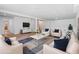 Staged basement living room with tile floors and comfortable white seating at 1661 Duxbury Nw Ln, Kennesaw, GA 30152