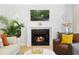Cozy living room featuring a fireplace, comfortable seating, and stylish decor at 1661 Duxbury Nw Ln, Kennesaw, GA 30152