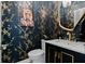Stylish powder room with elegant gold fixtures, designer wallpaper, and vanity with storage at 1661 Duxbury Nw Ln, Kennesaw, GA 30152