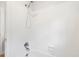 Clean white tiled shower with chrome shower head at 1661 Duxbury Nw Ln, Kennesaw, GA 30152