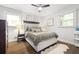 Comfortable bedroom with hardwood floors, decorative lamps, and bedside tables at 2572 Beverly Hills Drive Dr, Chamblee, GA 30341