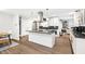 Modern kitchen with an island, stainless steel appliances, ample counter space, and hardwood floors at 2572 Beverly Hills Drive Dr, Chamblee, GA 30341