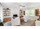 Bright living room featuring a fireplace, decorative shelves, comfortable seating, and natural light at 2572 Beverly Hills Drive Dr, Chamblee, GA 30341