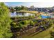 Aerial view of community with pond, putting green and recreational area at 380 2Nd St, Fayetteville, GA 30214