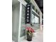 Exterior of a building with a sign for Sensu Sushi Restaurant and Bar and flower pot at 380 2Nd St, Fayetteville, GA 30214
