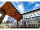 Modern building exterior under a geometric wood awning with a sunny blue sky at 380 2Nd St, Fayetteville, GA 30214