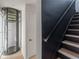 Hallway with an elevator and a staircase with a black handrail at 380 2Nd St, Fayetteville, GA 30214