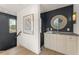 Hallway with a bar area, modern decor, and an eye-catching light fixture at 380 2Nd St, Fayetteville, GA 30214