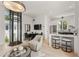 Open-concept living space with modern furniture, natural light, and a unique elevator feature at 380 2Nd St, Fayetteville, GA 30214