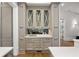 Dry bar with beautiful cabinetry and marble countertop at 4560 Harris Trl, Atlanta, GA 30327