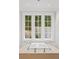 Bathroom featuring soaking tub with a view to the outside and elegant fixtures at 4560 Harris Trl, Atlanta, GA 30327