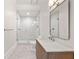 Bathroom with a glass-enclosed shower, vanity, and herringbone-patterned floor at 4560 Harris Trl, Atlanta, GA 30327