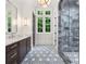Stylish bathroom with marble countertops, a glass-enclosed shower, and elegant fixtures throughout at 4560 Harris Trl, Atlanta, GA 30327