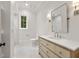 Bathroom featuring a vanity with light wood accents, a large mirror, and modern fixtures at 4560 Harris Trl, Atlanta, GA 30327
