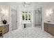 Luxurious bathroom featuring a soaking tub, glass shower, and patterned tile floor, offering a spa-like retreat at 4560 Harris Trl, Atlanta, GA 30327