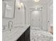 Elegant bathroom with marble floors, sleek vanity, and glass-enclosed shower offering a spa-like experience at 4560 Harris Trl, Atlanta, GA 30327