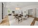 Bright bedroom with a seating area, large windows, and elegant decor at 4560 Harris Trl, Atlanta, GA 30327