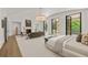Large bedroom with a seating area, fireplace, and large windows to enjoy views of the backyard at 4560 Harris Trl, Atlanta, GA 30327
