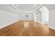 Bright, spacious bonus room with hardwood floors, modern lighting, and neutral paint at 4560 Harris Trl, Atlanta, GA 30327