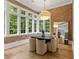 Cozy breakfast nook with brick walls and large windows offering natural light at 4560 Harris Trl, Atlanta, GA 30327