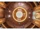 Unique circular ceiling with custom wood paneling and an elegant chandelier at 4560 Harris Trl, Atlanta, GA 30327