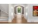 Inviting entryway with beautiful millwork and an arched doorway to another living space at 4560 Harris Trl, Atlanta, GA 30327