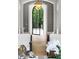 Inviting entryway featuring beautiful doors and a view to lush green landscape at 4560 Harris Trl, Atlanta, GA 30327