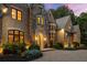 Stunning stone and brick home featuring a landscaped front yard and elegant entrance at 4560 Harris Trl, Atlanta, GA 30327