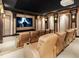 Luxurious home theater with tiered seating, starlit ceiling, and a large screen for immersive entertainment at 4560 Harris Trl, Atlanta, GA 30327