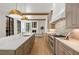 Gourmet kitchen boasts a spacious island, stone countertops, and high-end appliances at 4560 Harris Trl, Atlanta, GA 30327