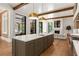 Gourmet kitchen featuring a large center island with marble countertops and stainless steel appliances at 4560 Harris Trl, Atlanta, GA 30327
