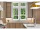 Well-appointed kitchen sink area with custom cabinetry and natural light from the large windows at 4560 Harris Trl, Atlanta, GA 30327