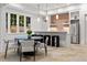Stylish kitchenette with modern cabinetry, a stainless steel refrigerator, and an adjacent dining area at 4560 Harris Trl, Atlanta, GA 30327